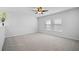 Spacious bedroom with neutral carpet, large windows, and a ceiling fan at 1309 Berry Grove Dr, Summerville, SC 29485