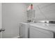 Laundry room with washer, dryer, and storage shelf at 1309 Berry Grove Dr, Summerville, SC 29485