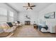 Bright living room with neutral walls, wood floors, and a ceiling fan at 1309 Berry Grove Dr, Summerville, SC 29485