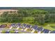 Overhead view showcases the proximity to a dense forest and a serene pond or lake at 1384 Locals St, Summerville, SC 29485