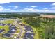 Aerial shot overlooking a residential area backing up to a lush green forest and new development at 1384 Locals St, Summerville, SC 29485
