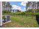 Fenced backyard showing level lawn, mature trees, and quiet seclusion at 1384 Locals St, Summerville, SC 29485
