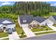 Charming home with manicured lawn, porch, and driveway, surrounded by mature trees at 1384 Locals St, Summerville, SC 29485