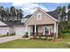 Charming single-Gathering home with a two-car garage, inviting front porch, and manicured lawn at 1384 Locals St, Summerville, SC 29485
