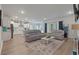 Open-concept living room with hardwood floors, recessed lighting, and a view to the kitchen at 1384 Locals St, Summerville, SC 29485