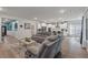 Open-concept living room with hardwood floors, recessed lighting, and a view to the kitchen at 1384 Locals St, Summerville, SC 29485