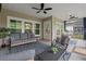 Comfortable screened porch area perfect for relaxing with ample seating and ceiling fans at 1384 Locals St, Summerville, SC 29485