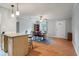 Bright open-concept dining area and kitchen combination features a ceiling fan and natural light at 14 Aldene Ave, Goose Creek, SC 29445