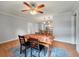 Bright dining room with a view into the kitchen, and natural lighting at 14 Aldene Ave, Goose Creek, SC 29445