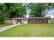 Charming single-story home featuring a well-maintained lawn, brick accents and a welcoming front entrance at 14 Aldene Ave, Goose Creek, SC 29445