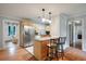 Modern kitchen with stainless steel appliances, granite countertops, and an open layout leading to living areas at 14 Aldene Ave, Goose Creek, SC 29445