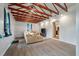 Cozy living room with wood beams and an open layout to kitchen at 14 Aldene Ave, Goose Creek, SC 29445