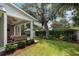 Lush backyard featuring a well-manicured lawn, hedges, a shed, and covered patio at 1405 Mataoka St, Mount Pleasant, SC 29464