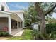 View of the home's exterior and covered patio from the backyard at 1405 Mataoka St, Mount Pleasant, SC 29464