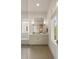 Bright bathroom features a vanity with storage, large mirror, and natural light at 1405 Mataoka St, Mount Pleasant, SC 29464