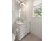 Well-lit bathroom features a vanity, large mirror, and neutral tones at 1405 Mataoka St, Mount Pleasant, SC 29464