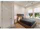 Bright bedroom featuring a queen-sized bed and natural light from the large windows at 1405 Mataoka St, Mount Pleasant, SC 29464