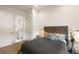 Comfortable bedroom featuring neutral colors, a modern lamp, and an adjacent bathroom at 1405 Mataoka St, Mount Pleasant, SC 29464