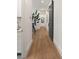 Hallway featuring hardwood floors, white walls, and a sliding barn door at 1405 Mataoka St, Mount Pleasant, SC 29464