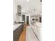 Open-concept kitchen featuring stainless steel appliances, gray cabinets, and an eat-in island at 1405 Mataoka St, Mount Pleasant, SC 29464