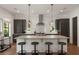 Spacious kitchen featuring stainless steel appliances, granite countertops, and a large center island with seating at 1405 Mataoka St, Mount Pleasant, SC 29464