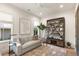 Inviting living room with a comfortable sofa, shelving unit, and ample natural light at 1405 Mataoka St, Mount Pleasant, SC 29464