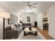 Spacious living room with a large sectional sofa, ceiling fan, and access to office space at 1405 Mataoka St, Mount Pleasant, SC 29464
