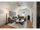 Comfortable living room with vaulted ceiling, gray sofa, and stylish ceiling fan at 1405 Mataoka St, Mount Pleasant, SC 29464