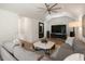 Cozy living room with a large sectional sofa, media center, and natural light at 1405 Mataoka St, Mount Pleasant, SC 29464