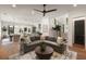 Spacious living room is complete with a large sectional and stylish decor at 1405 Mataoka St, Mount Pleasant, SC 29464