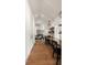 Open office space with vaulted ceiling, built-in desk, and view into the living room at 1405 Mataoka St, Mount Pleasant, SC 29464