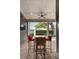 Covered outdoor patio featuring an outdoor dining space, ceiling fan, and TV at 1405 Mataoka St, Mount Pleasant, SC 29464