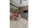 A covered patio featuring ceiling fans, a TV, and an outdoor dining area at 1405 Mataoka St, Mount Pleasant, SC 29464