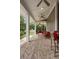 Inviting covered patio with a ceiling fan, outdoor seating, and garden views at 1405 Mataoka St, Mount Pleasant, SC 29464