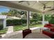 Covered patio with brick floor, ceiling fans, outdoor furniture and view of manicured backyard at 1405 Mataoka St, Mount Pleasant, SC 29464