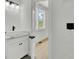 Bathroom featuring a modern vanity, stylish mirror, and herringbone tile accent wall at 142 Argosy Dr, Summerville, SC 29483