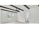 Bright, airy bedroom with wood flooring, exposed beams, and large windows for plenty of natural light at 142 Argosy Dr, Summerville, SC 29483