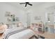 Cozy bedroom with natural light, hardwood floors, and a decorative shelving unit with books and toys at 142 Argosy Dr, Summerville, SC 29483