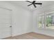 Inviting bedroom featuring hardwood floors, bright windows, and a modern ceiling fan at 142 Argosy Dr, Summerville, SC 29483