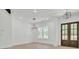 Open dining area with modern lighting fixture and sun-filled windows, perfect for entertaining guests at 142 Argosy Dr, Summerville, SC 29483