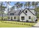Eye-catching exterior with white siding, black trim, and manicured landscaping enhancing curb appeal at 142 Argosy Dr, Summerville, SC 29483