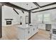 Modern kitchen with an island, stainless steel appliances, and a view to the living room at 142 Argosy Dr, Summerville, SC 29483