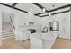 Stylish kitchen with white cabinets, stainless steel appliances, marble countertops, and wooden beam accents at 142 Argosy Dr, Summerville, SC 29483