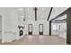 Open-concept living room with a vaulted ceiling, fireplace, and neutral color palette at 142 Argosy Dr, Summerville, SC 29483