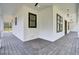 Inviting covered porch with grey stained wood flooring and outdoor ceiling fans at 142 Argosy Dr, Summerville, SC 29483