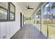 Covered porch featuring a stained wood floor and modern railings at 142 Argosy Dr, Summerville, SC 29483
