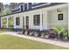 Inviting front porch with rod iron railing and manicured landscaping, perfect for relaxing outdoors at 142 Argosy Dr, Summerville, SC 29483