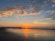 Beautiful beach sunset with golden sky reflecting in the wet sand at 1427 Dahlia Rd, Mount Pleasant, SC 29464