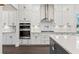 Well-lit modern kitchen featuring white cabinets, stainless steel appliances, and stylish countertops at 1427 Dahlia Rd, Mount Pleasant, SC 29464