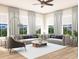 Spacious living room with modern decor, large windows, and comfortable seating arrangements under a ceiling fan at 1427 Dahlia Rd, Mount Pleasant, SC 29464